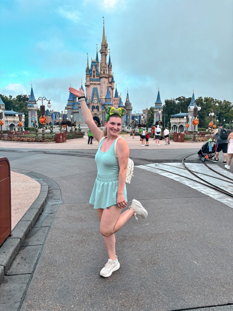 Alexis Evans - Travel Planner with Kingdom Planners in front of Cinderella Castle in the Magic Kingdom